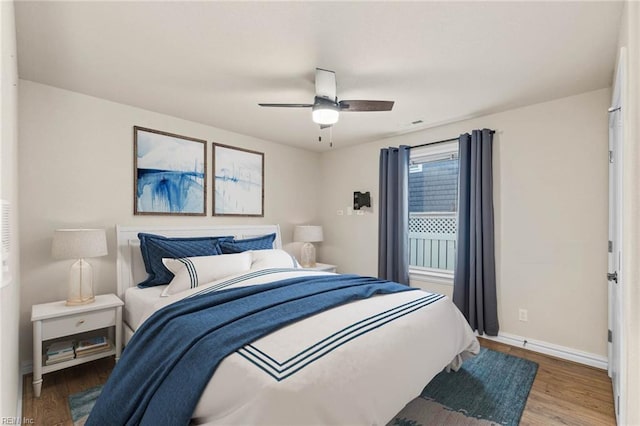 bedroom featuring ceiling fan and wood-type flooring