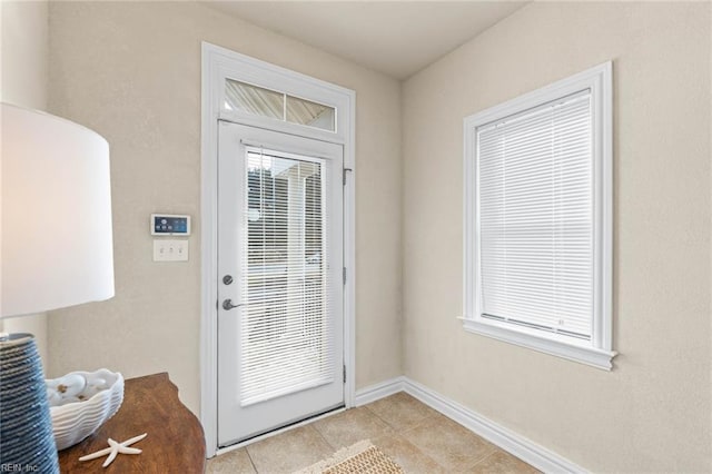 doorway featuring light tile patterned floors