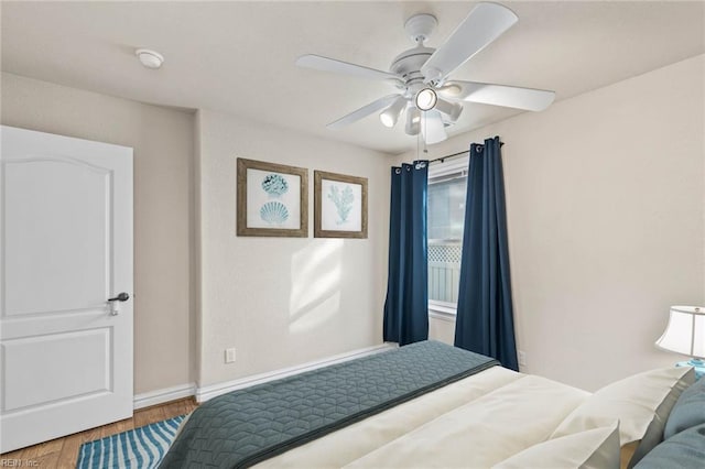 bedroom featuring hardwood / wood-style floors and ceiling fan