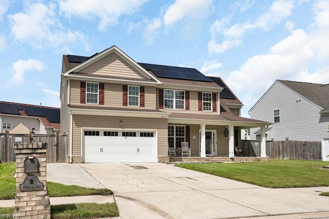 view of front of house featuring a front lawn, a garage, solar panels, and a porch