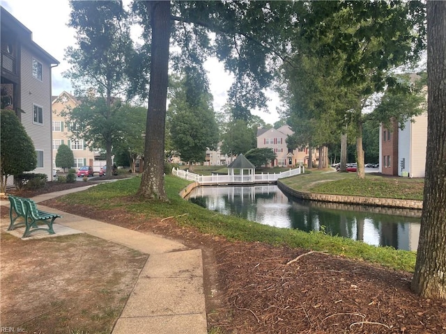 view of community with a water view and a gazebo