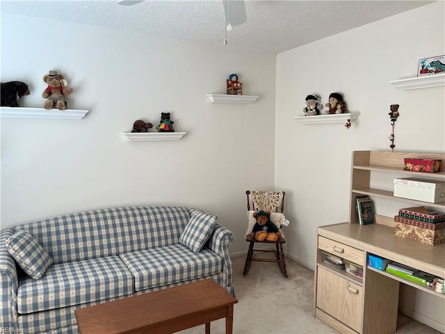 living area with a textured ceiling and light carpet