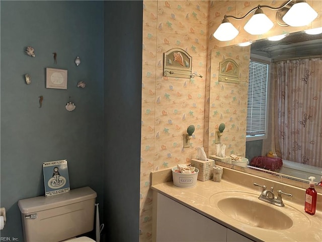 bathroom with vanity and toilet