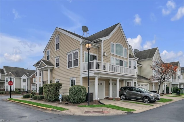 exterior space featuring a garage and a balcony