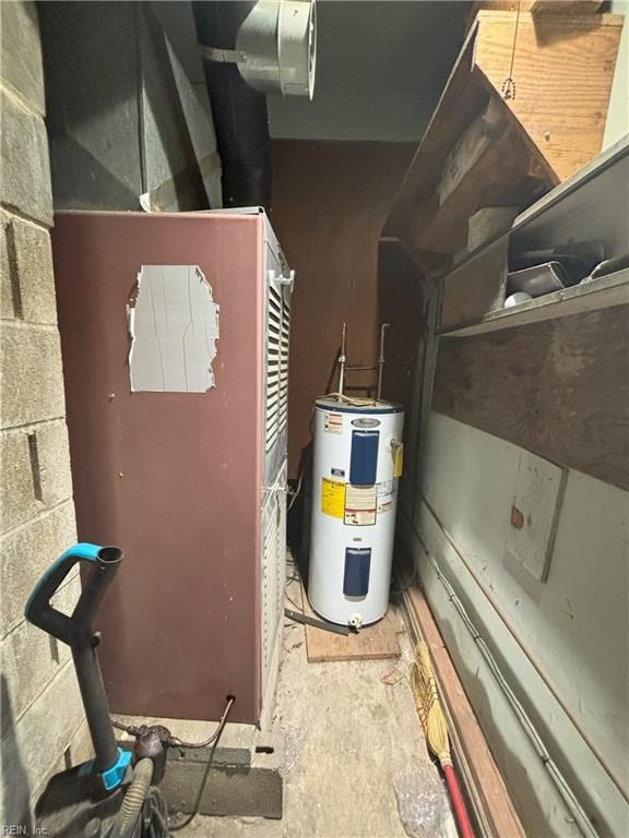 utility room featuring water heater