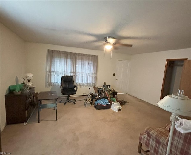 interior space with carpet flooring and ceiling fan