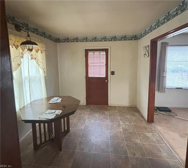 view of carpeted foyer