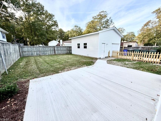 deck featuring an outbuilding and a yard