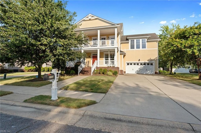 view of front of property with a balcony, driveway, a garage, and a porch