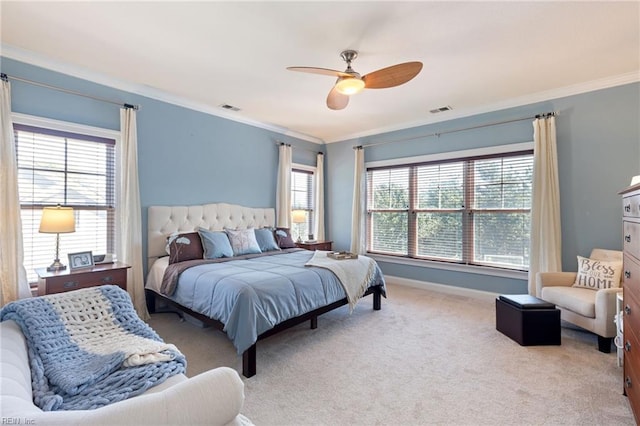 bedroom with light colored carpet, visible vents, crown molding, and baseboards