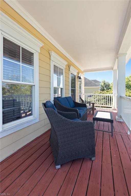 wooden terrace featuring covered porch