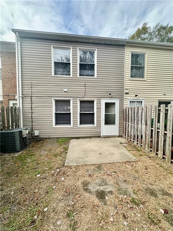 back of house featuring central AC unit and a patio area