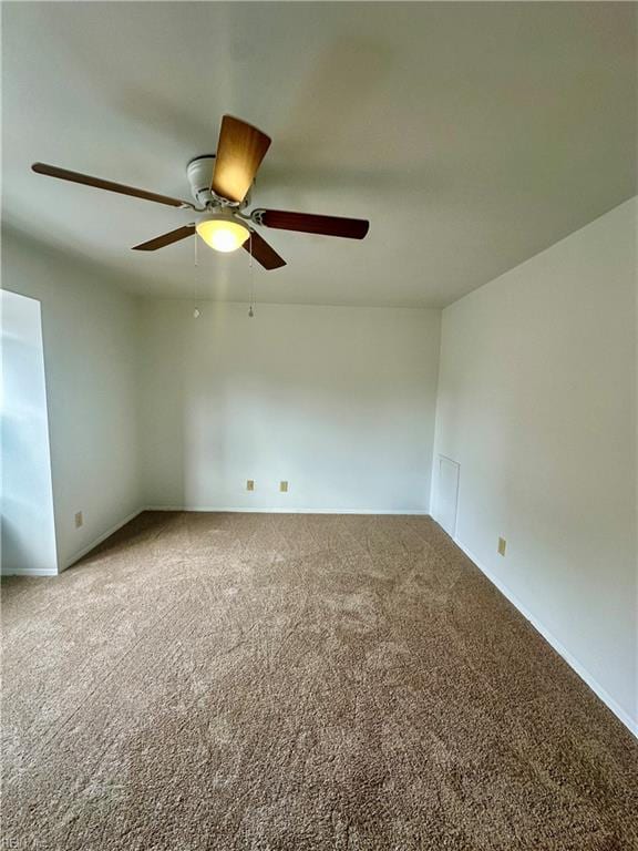 unfurnished room featuring carpet and ceiling fan