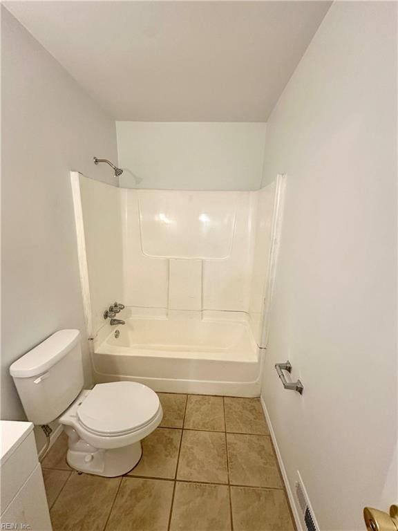 bathroom with shower / bath combination, tile patterned floors, and toilet