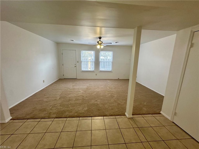 interior space with ceiling fan