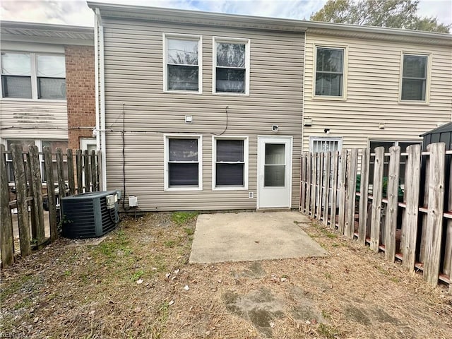 back of house featuring central AC unit