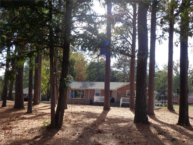 single story home featuring central AC unit