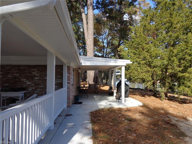 view of patio featuring a grill