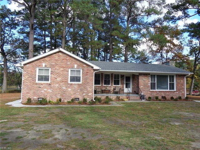 single story home with a front yard and a porch