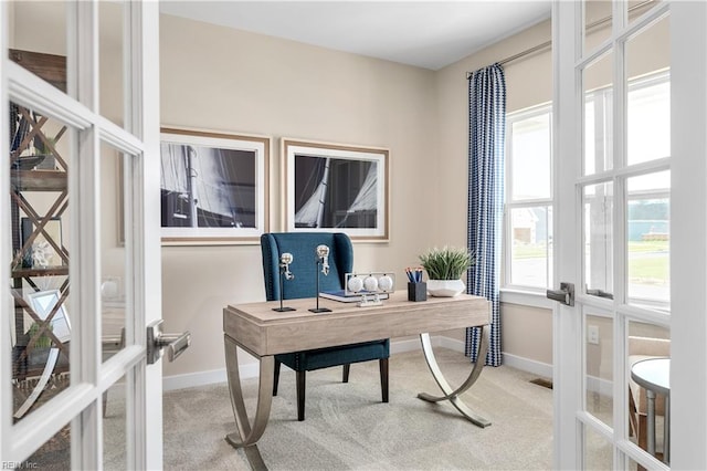 carpeted office with french doors