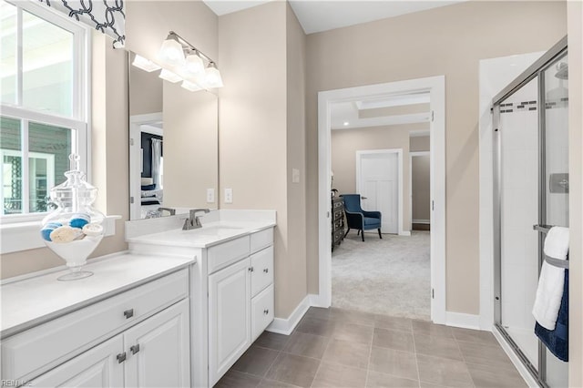 bathroom with vanity, tile patterned floors, and a shower with shower door