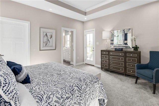 bedroom featuring access to exterior, light colored carpet, and ensuite bathroom