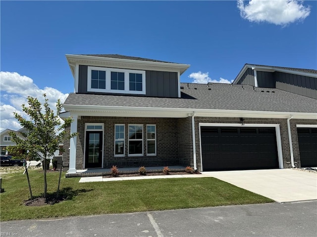 view of front facade featuring a front lawn, a garage, and a porch