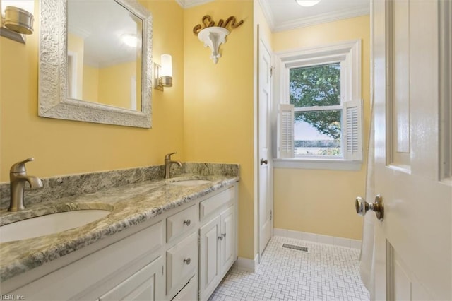 bathroom featuring ornamental molding and vanity