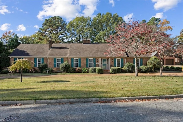 ranch-style house featuring a front lawn