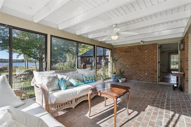 sunroom with beamed ceiling, a water view, ceiling fan, and wood ceiling