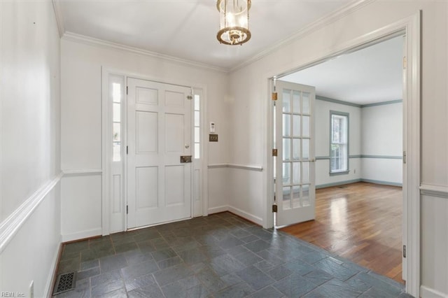 entryway featuring ornamental molding and dark hardwood / wood-style flooring