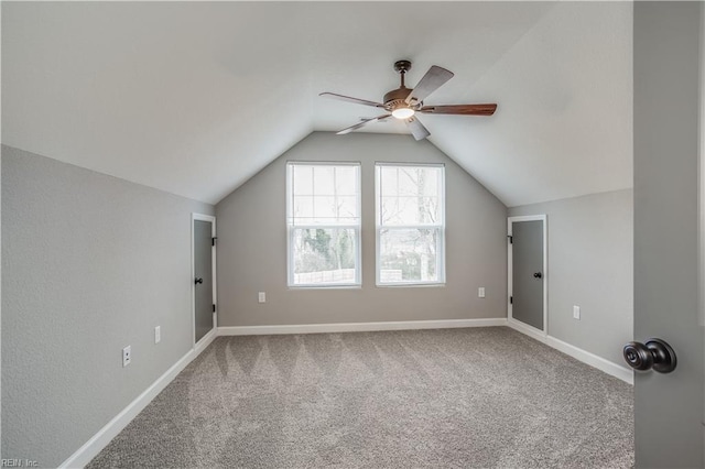 additional living space with carpet, ceiling fan, and lofted ceiling