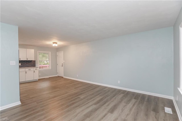 unfurnished living room with light hardwood / wood-style floors