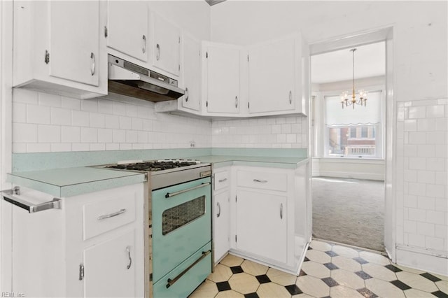 kitchen with white cabinetry, white range with gas stovetop, and decorative light fixtures