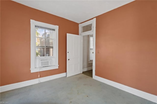 carpeted empty room featuring cooling unit