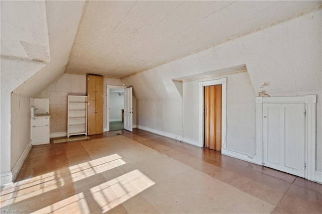 bonus room with vaulted ceiling