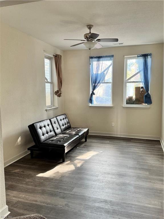 unfurnished room with dark hardwood / wood-style floors and ceiling fan