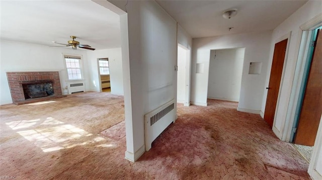 hall featuring radiator and light carpet