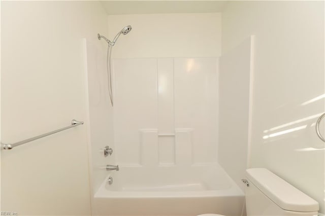 bathroom with toilet and tub / shower combination