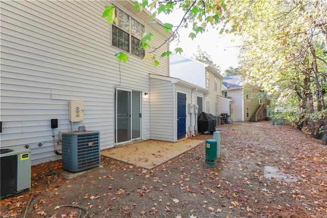 view of property exterior featuring a patio and central air condition unit