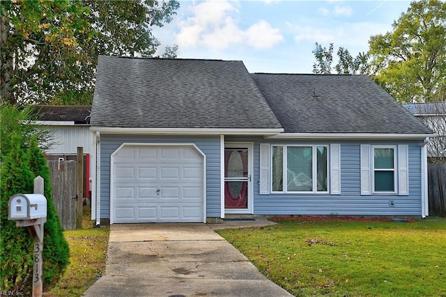 view of front of house featuring a garage and a front lawn