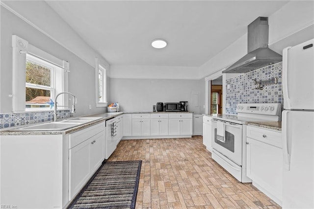 kitchen with sink, wall chimney range hood, backsplash, white cabinetry, and white appliances