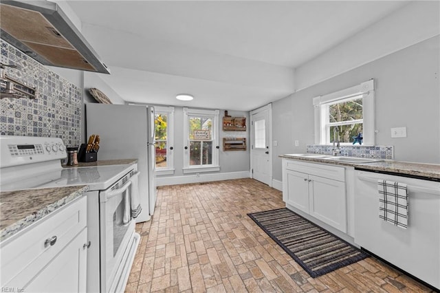 kitchen with white cabinets, decorative backsplash, exhaust hood, and white appliances