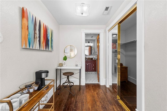 hall with dark wood-type flooring