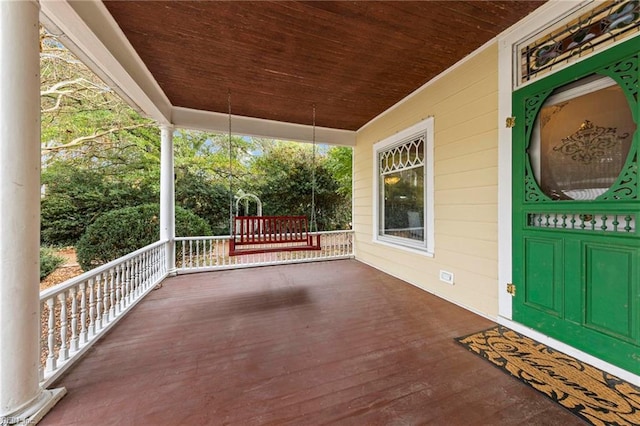 wooden terrace featuring a porch