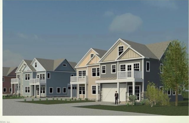 view of front of home with a balcony and a garage