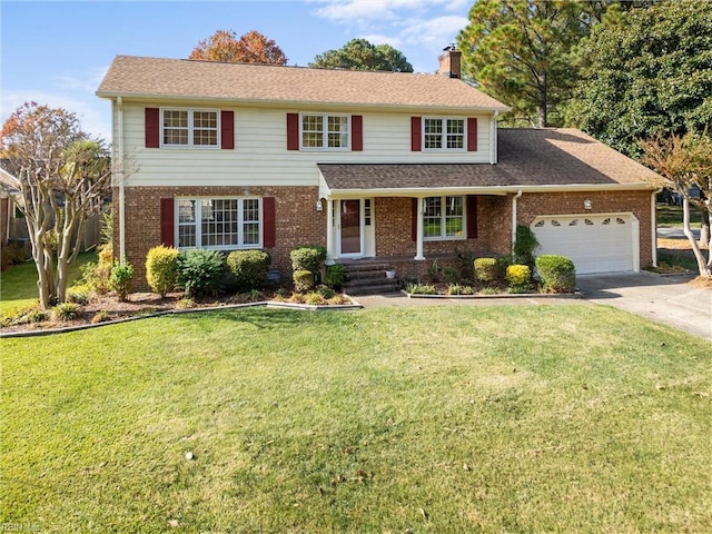 view of front of property with a front lawn and a garage