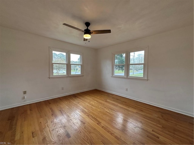 unfurnished room with light wood-type flooring and ceiling fan