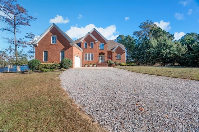 view of front property with a front lawn and a garage