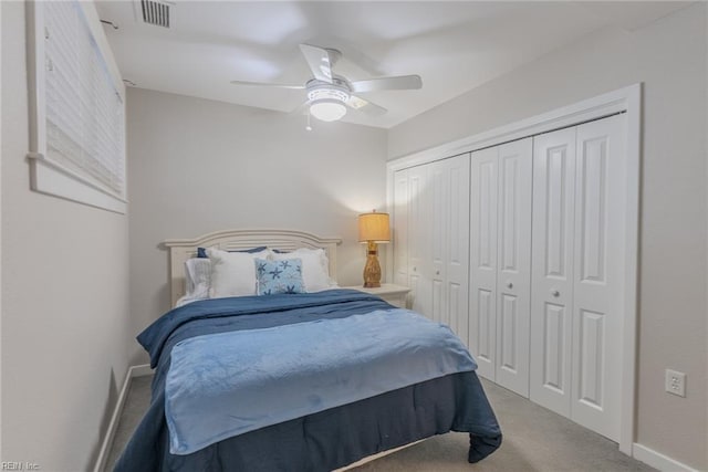 bedroom featuring light carpet, a closet, and ceiling fan